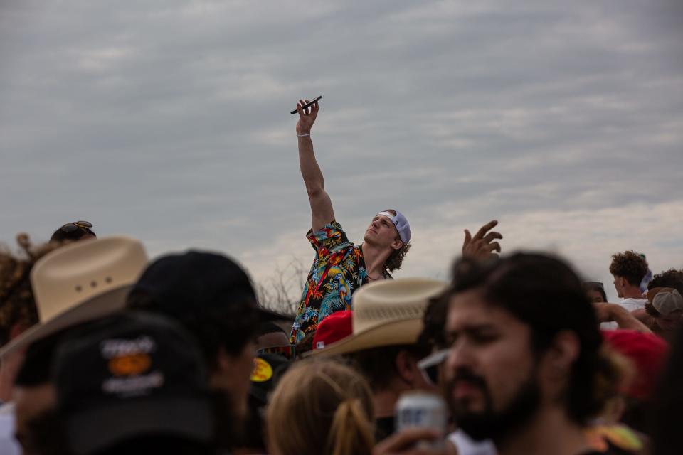 Hundreds of people gather on the beach near mile marker 32 for spring break on Wednesday, March 15, 2023, in Port Aransas, Texas. 