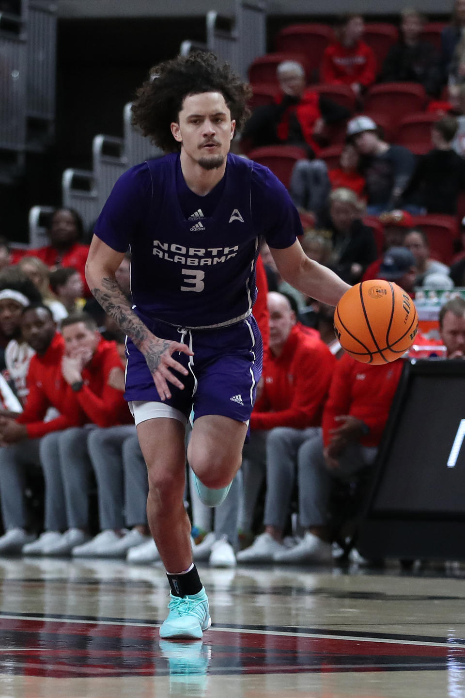 Jan 1, 2024; Lubbock, Texas, USA;  North Alabama Lions guard KJ Johnson (3) dribbles the ball against the Texas Tech Red Raiders in the second half at United Supermarkets Arena. Mandatory Credit: Michael C. Johnson-USA TODAY Sports