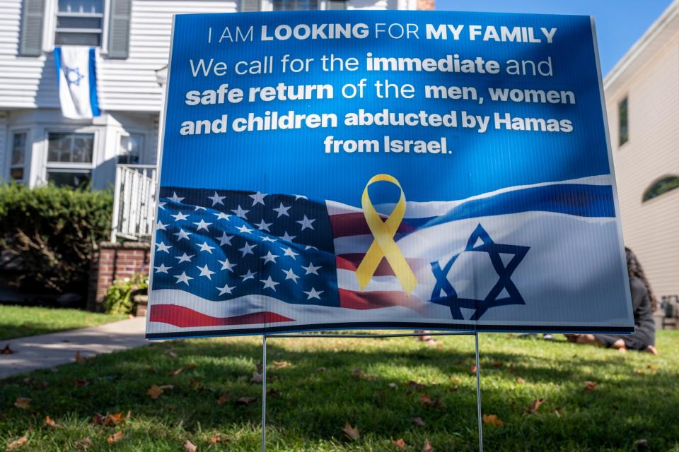 Chavie Hagler and her friends are selling lawn signs to help raise awareness of people in Israel who were kidnapped and who are missing. A sign sits in front of Hagler's Bergenfield home on Friday, October 13, 2023.