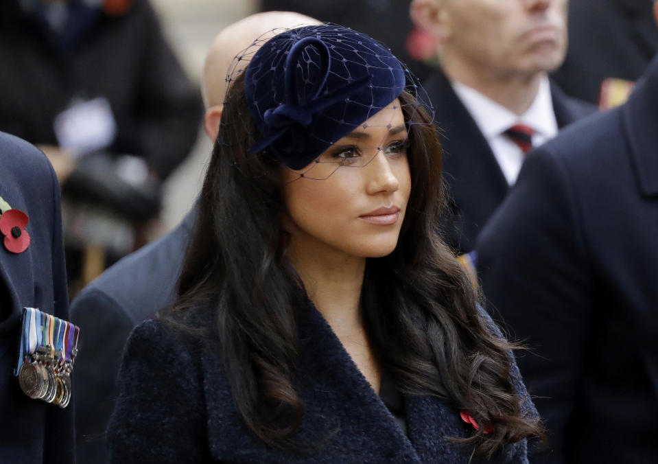 FILE - In this Thursday, Nov. 7, 2019 file photo Meghan the Duchess of Sussex stands after she and her husband Britain's Prince Harry placed a Cross of Remembrance as they attend the official opening of the annual Field of Remembrance at Westminster Abbey in London. King Charles will hope to keep a lid on those tensions when his royally blended family joins as many as 2,800 guests for the new king’s coronation on May 6 at Westminster Abbey. All except Meghan, the Duchess of Sussex, who won’t be attending. (AP Photo/Matt Dunham, File)