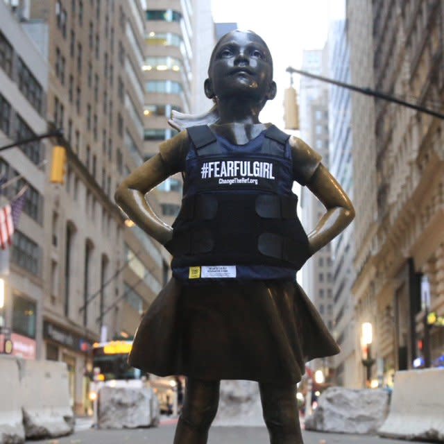 The “Fearless Girl” statue donned a bulletproof vest on Friday to protest mass shootings in America. (Credit: Twitter)