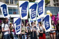 People hold posters reading: 'Elect a Europe for all' and 'Your choice - May 26' as they attend a demonstration in Berlin, Germany, Sunday, May 19, 2019. People across Europe attend demonstrations under the slogan 'A Europe for All - Your Voice Against Nationalism'. (AP Photo/Markus Schreiber)