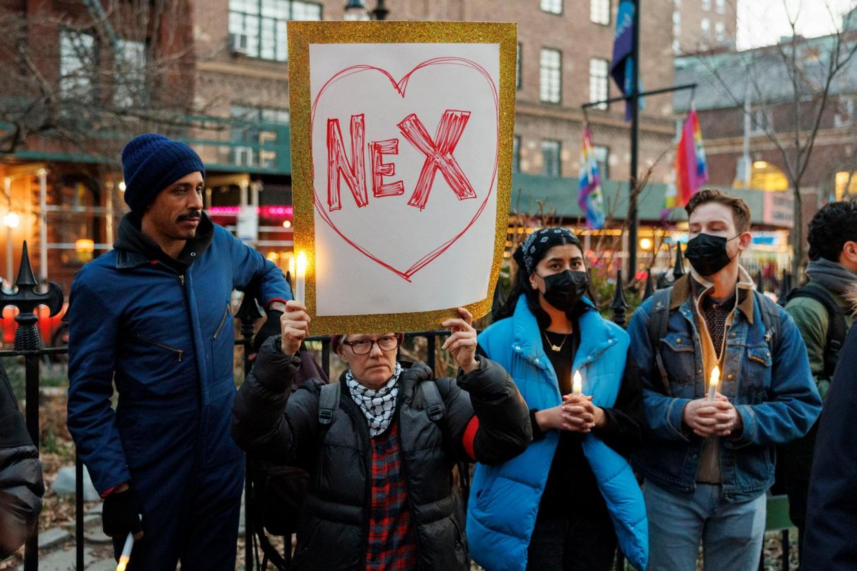 <span>People hold a vigil for Nex Benedict outside Stonewall Inn in New York on 26 February.</span><span>Photograph: Sarah Yenesel/EPA</span>