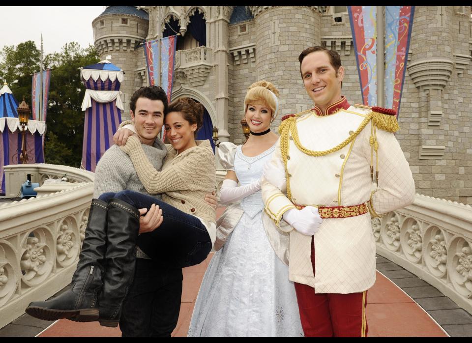 To celebrate their first wedding anniversary, Kevin Jonas of the pop trio 'Jonas Brothers' and his wife Danielle Jonas pose on December 19, 2010 in front of Cinderella Castle with Cinderella and Prince Charming at the Magic Kingdom in Lake Buena Vista, Florida.     The couple wed December 19, 2009 at Oheka Castle in Long Island, New York, and will celebrate their first anniversary by staying Sunday night in the Cinderella Castle Suite, the only hotel room inside the Walt Disney World theme park castle.     (Photo by Preston Mack/Disney via Getty Images)