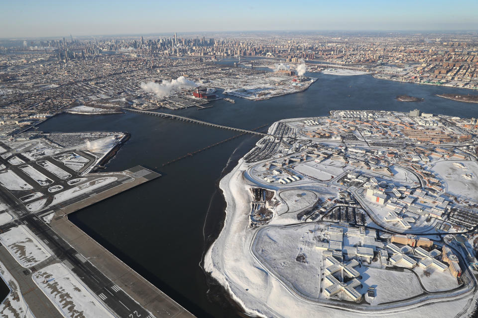 Rikers Island jail complex (R) stands under a blanket of snow next to La Guardia Airport on January 5, 2018 in the Bronx borough of New York City.&nbsp;