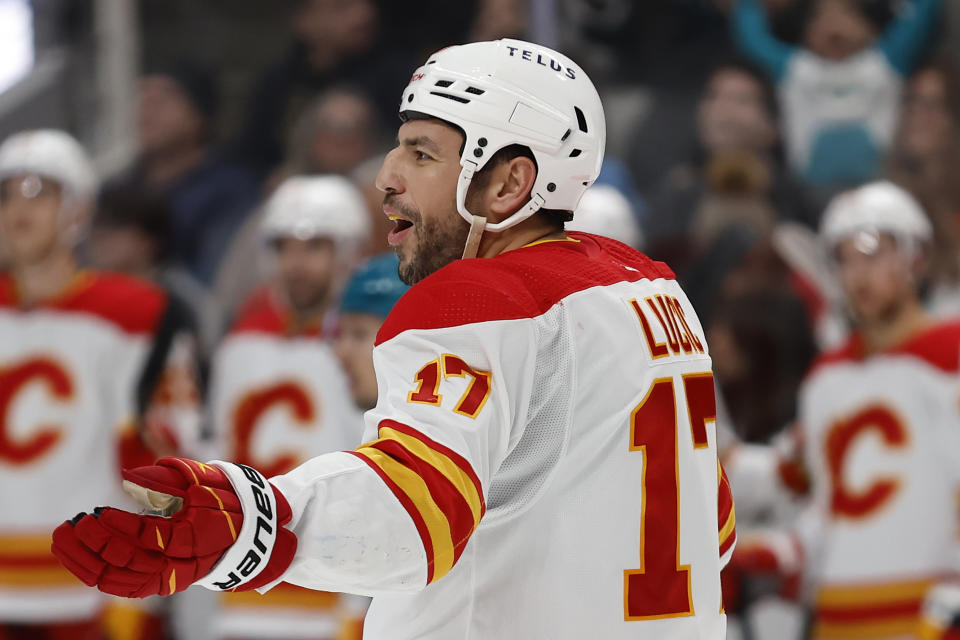 Calgary Flames left wing Milan Lucic (17) celebrates after scoring a goal in the second period of an NHL hockey game against the San Jose Sharks Sunday, Dec.18, 2022, in San Jose, Calif. (AP Photo/Josie Lepe)