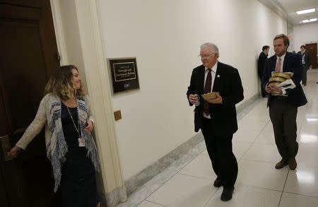 Rep Joe Barton (R-TX) (C) carries his lunch followed by an aide with more lunches as he heads into a Freedom Caucus meeting on Capitol Hill after meeting with President Donald Trump at the White House in Washington, U.S., March 23, 2017. REUTERS/Jonathan Ernst