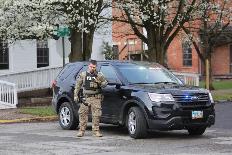 Police surround former city councilman Michael Mearan's home in Portsmouth, Ohio, on March 25, 2020.