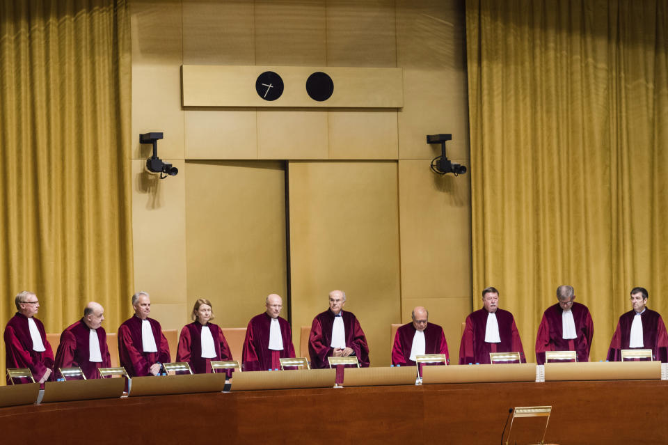 FILE - In this Tuesday, Oct. 6, 2015 file photo, judges preside over a case at the European Court of Justice in Luxembourg. A European Union high court on Wednesday, July 15, 2020 ruled in favor of technology giant Apple and Ireland in its dispute with the EU over 13 billion euros, 15 billion US dollars in back taxes. (AP Photo/Geert Vanden Wijngaert, File)