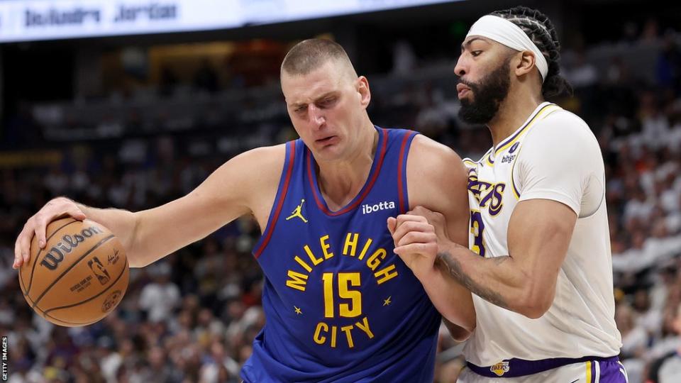 Denver Nuggets centre Nikola Jokic (left) battles with opposite number Anthony Davis (right) of the Los Angeles Lakers