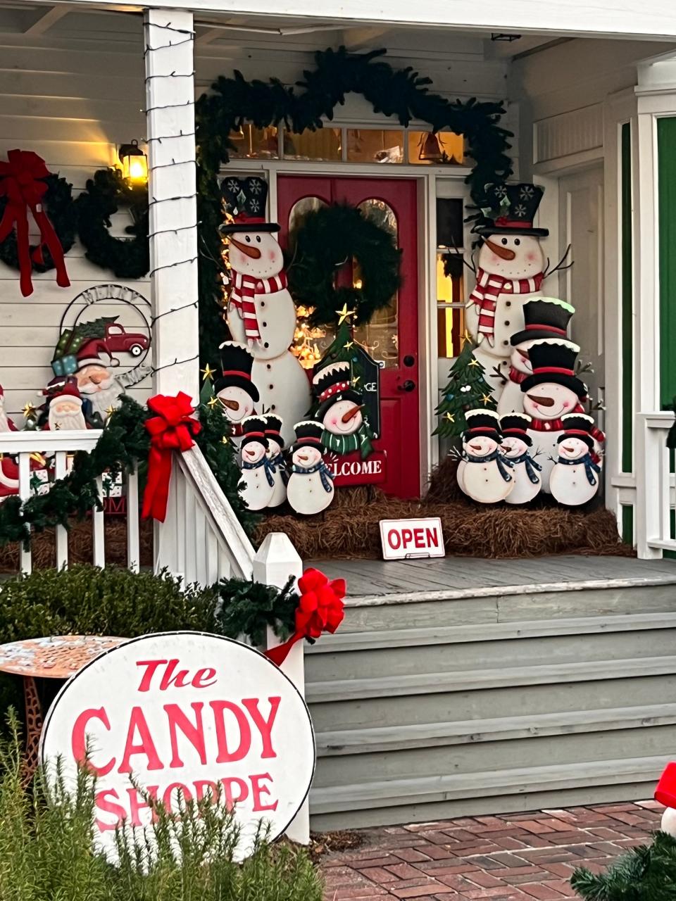 Snowmen and santas adorn the entrance of The Christmas House in downtown Southport on Wednesday, November 30, 2022.