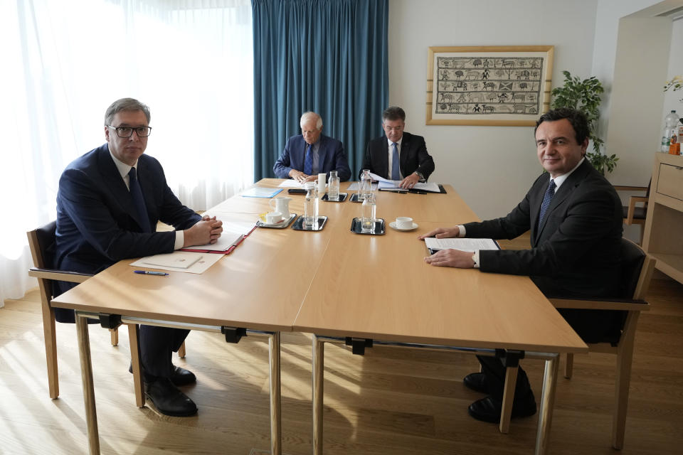 From left, Serbia's President Aleksandar Vucic, European Union foreign policy chief Josep Borrell, EU Special Representative Miroslav Lajcak and Kosovo's Prime Minister Albin Kurti meet together in Brussels, Thursday, Sept. 14, 2023. The leaders of Serbia and Kosovo are holding a fresh round of meetings on Thursday aimed at improving their strained relations as calls mount for a change in the Western diplomatic approach toward them amid concern that their tensions could spiral out of control. (AP Photo/Virginia Mayo)