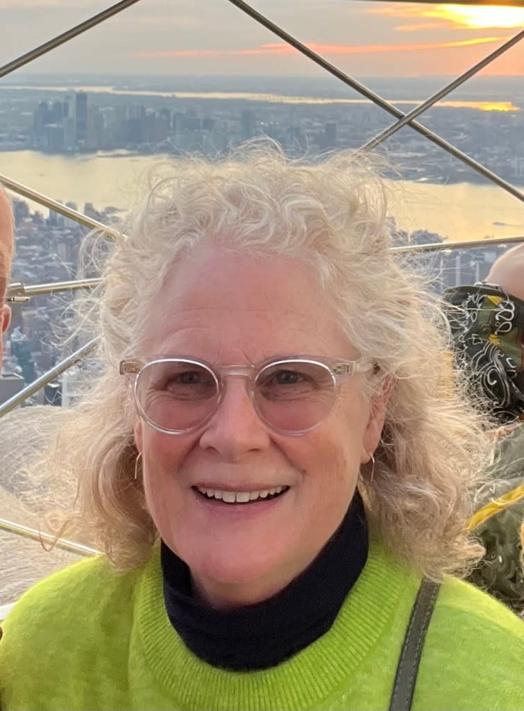 A photo of Joy, 66, at the top of the Empire State Building.