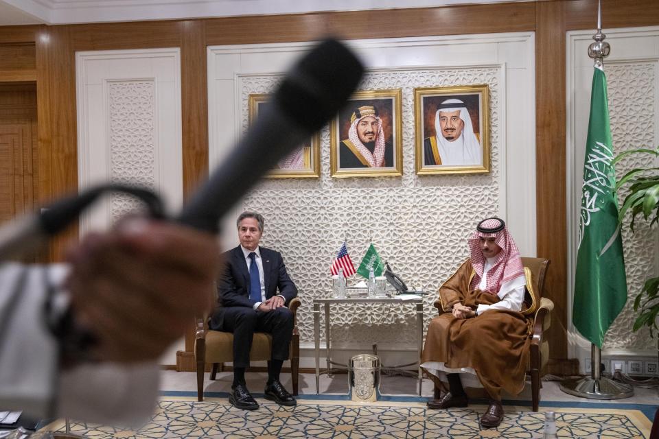 FILE - Secretary of State Antony Blinken, left, meets with Saudi Foreign Minister Prince Faisal bin Farhan, at the Ministry of Foreign Affairs in Riyadh, Saudi Arabia, Oct. 14, 2023. AP Washington photographer Jacquelyn Martin recalls how being one of a few female photographers covering news and politics was useful when she was assigned as the press pooler for Blinken's last-minute trip to Israel and the Middle East in the aftermath of the Hamas attacks. Martin said, “Sometimes people not knowing what to make of you works in your favor.” (AP Photo/Jacquelyn Martin, Pool, File)