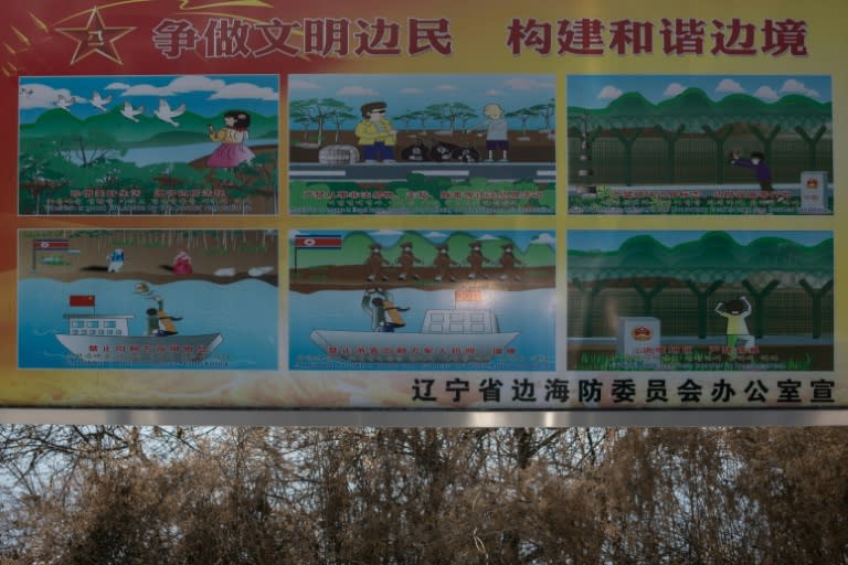 A sign in Dandong gives instructions on how to behave near the North Korean border - including no smuggling or taking photos of troops