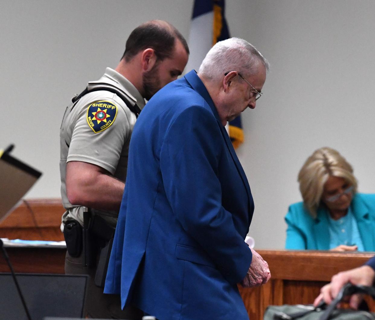 Ronnie Killingsworth is escorted out of 30th District Court in handcuffs at the Wichita County Courthouse on Tuesday after guilty verdicts were announced.