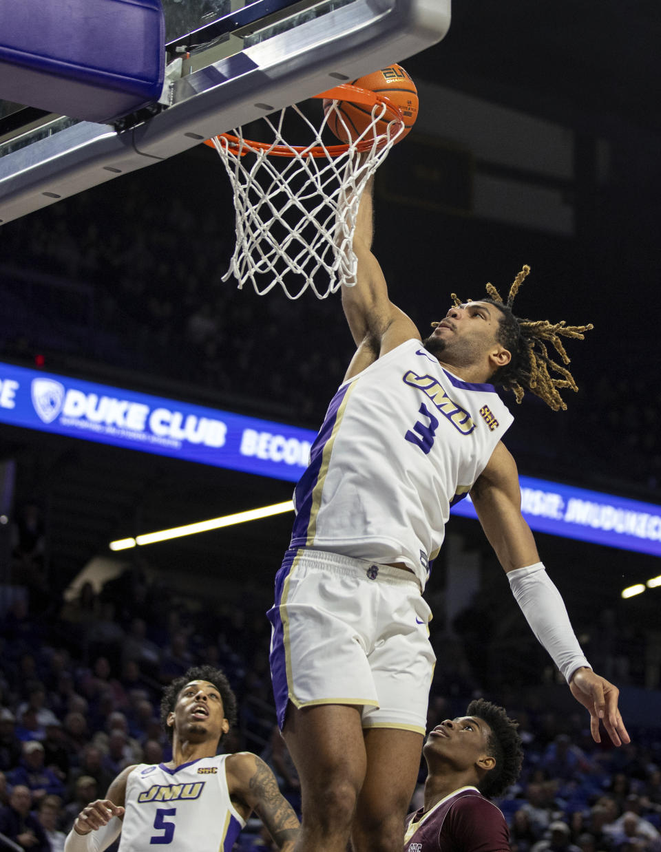 James Madison forward T.J. Bickerstaff (3) goes up for a slam dunk during the first half of an NCAA college basketball game against Texas State in Harrisonburg, Va., Saturday, Dec. 30, 2023. (Daniel Lin/Daily News-Record via AP)