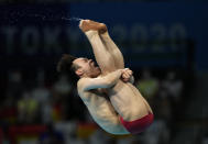 Xie Siyi of China competes in men's diving 3m springboard final at the Tokyo Aquatics Centre at the 2020 Summer Olympics, Tuesday, Aug. 3, 2021, in Tokyo, Japan. (AP Photo/Dmitri Lovetsky)