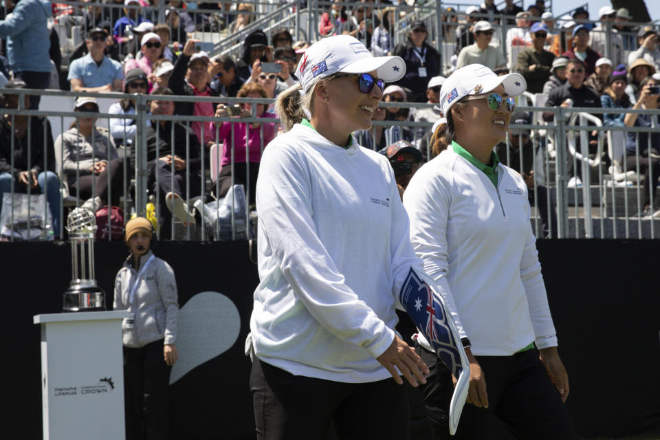 Australia's Sarah Kemp, left, and Minjee Lee walk onto the first tee for the finals at the International Crown match play golf tournament in San Francisco, Sunday, May 7, 2023. (AP Photo/Benjamin Fanjoy)