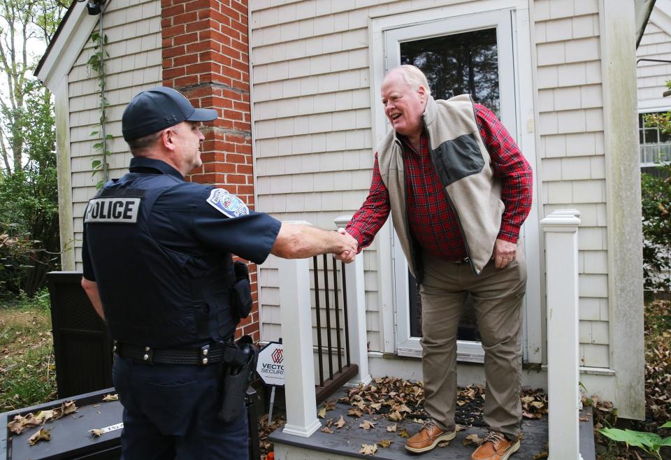 Brentwood resident David Eldridge comes out of his home to say thanks to officer Bob McConn for delivering his McDonald’s, DoorDash food delivery. McConn took over the delivery after the original driver was arrested for a suspended license.