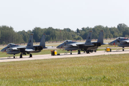 U.S. Air Force F-15C Eagle fighters deployed to NATO Baltic air policing mission are parked in the military air field in Siauliai, Lithuania August 30, 2017. REUTERS/Ints Kalnins