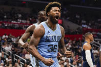 Memphis Grizzlies guard Marcus Smart reacts after scoring and drawing an and-one during the second half of an NBA basketball game against the Los Angeles Clippers, Sunday, Nov. 12, 2023, in Los Angeles. (AP Photo/Ryan Sun)