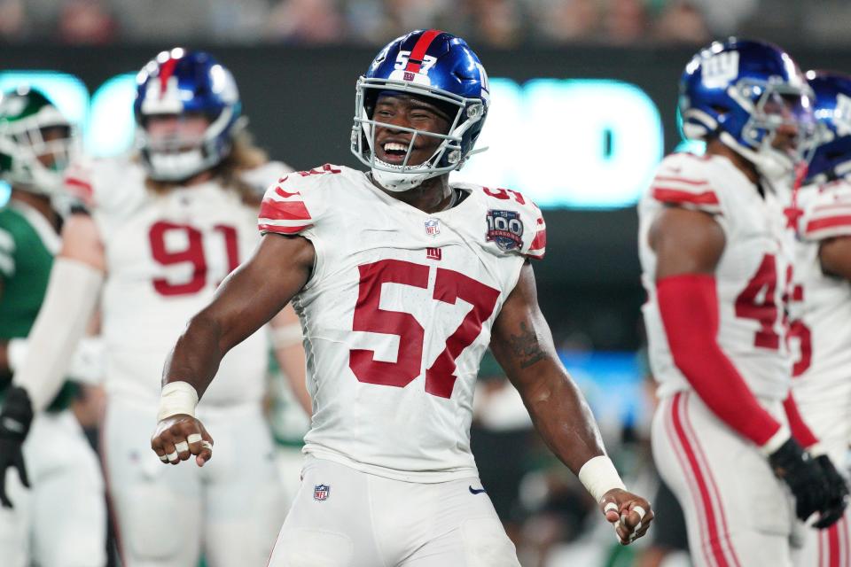 EAST RUTHERFORD, NEW JERSEY - AUGUST 24: K.J. Cloyd #57 of the New York Giants celebrates against the New York Jets during the second half of a preseason game at MetLife Stadium on August 24, 2024 in East Rutherford, New Jersey. (Photo by Evan Bernstein/Getty Images)