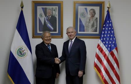 El Salvador's President Salvador Sanchez Ceren (L), shakes hands with U.S. Attorney General Jeff Sessions (R) during a visit in San Salvador, El Salvador, July 27, 2017. Presidency El Salvador/Handout via Reuters