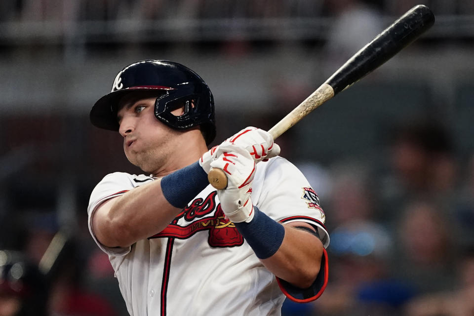 Atlanta Braves' Austin Riley follows though on a two-run single during the third inning of the team's baseball game against the New York Mets on Wednesday, June 30, 2021, in Atlanta. (AP Photo/John Bazemore)