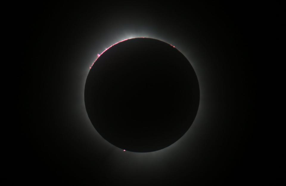 A total solar eclipse is viewed from the north patio of the Bayfront Convention Center in Erie on Monday.