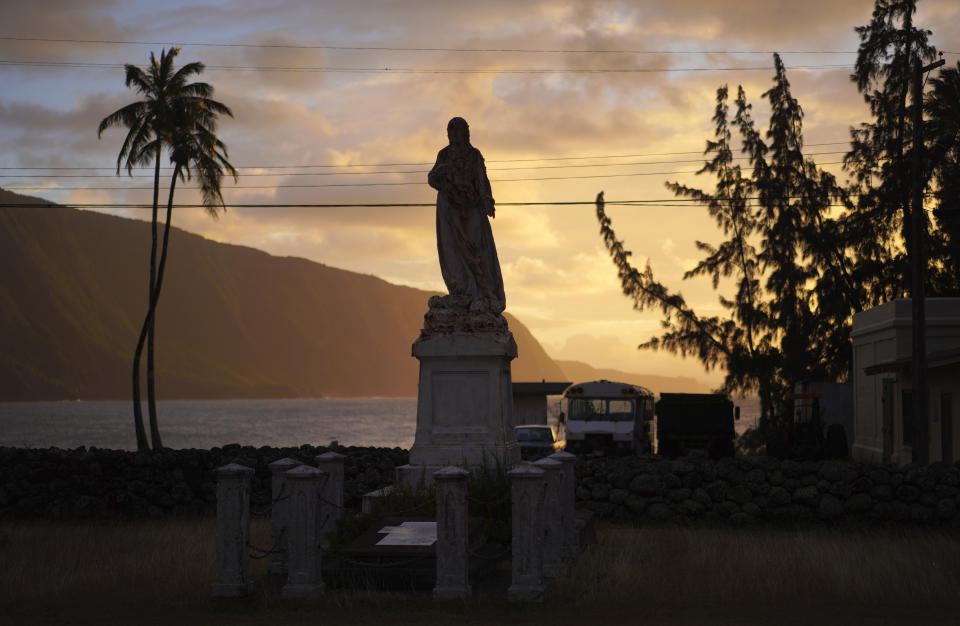 The memorial of the Rev. Maxim Andre of the Congregation of the Sacred Hearts, on the peninsula of Kalaupapa, Hawaii, on Tuesday, July 18, 2023. (AP Photo/Jessie Wardarski)