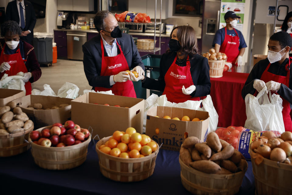 Vice President Kamala Harris and second gentleman Douglas Emhoff fill bags with food for the needy at Martha’s Table — a community-based education, health and family services organization — during Martin Luther King Jr. Day in Washington, D.C. (Photo by Chip Somodevilla/Getty Images)