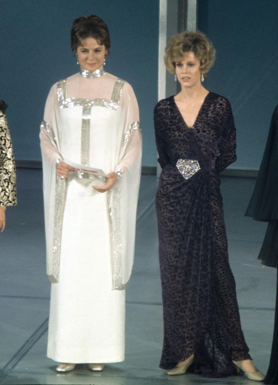 Here, the actress, standing beside Jane Fonda, wore a white and silver gown to present an award at the Academy Awards in 1969.&nbsp;