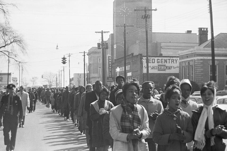 Alabama State troopers 'frisk' Negro youths arrested during demonstrations here prior to boarding them on buses. More than 130 were arrested in Marion, AL on Feb. 5, 1965.&nbsp;