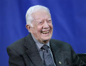 FILE - In this Sept. 18, 2018 file photo, former President Jimmy Carter answers questions from students during his annual town hall with Emory University freshman in the campus gym in Atlanta. Carter carved an unlikely path to the White House in 1976 and endured humbling defeat after one term. Now, six administrations later, the longest-living chief executive in American history is re-emerging from political obscurity at age 94 to win over his fellow Democrats once again. (Curtis Compton/Atlanta Journal-Constitution via AP, File)/