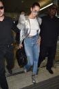 <p>In a silver Marc Jacobs moto jacket with patchwork frayed jeans, metallic ankle booties, a Givenchy handbag and aviator sunglasses while arriving at Nice airport in France. </p>