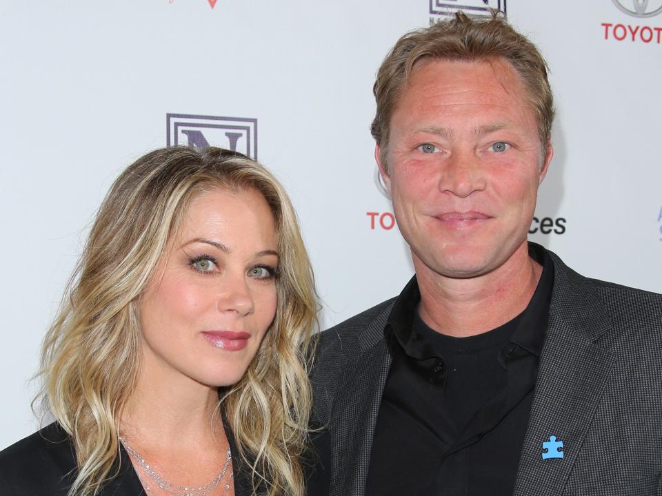 Christina Applegate (L) and her Husband Musician Martyn Lenoble (R) attend the 3rd annual "Light Up The Blues" concert to benefit "Autism Speaks" at the Pantages Theatre on April 25, 2015 in Hollywood, California