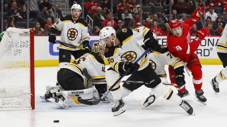 Boston Bruins defenseman Matt Grzelcyk (48) clears the puck in the second period of an NHL hockey game against the Detroit Red Wings, Sunday, Feb. 9, 2020, in Detroit. (AP Photo/Paul Sancya)