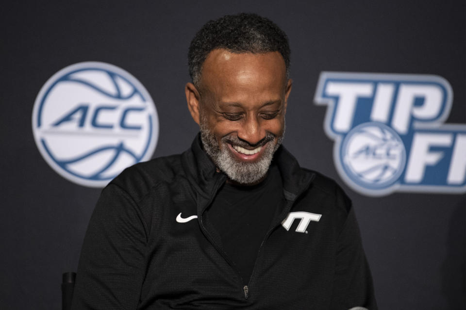 Virginia Tech head coach Kenny Brooks laughs during NCAA college basketball Atlantic Coast Conference media day, Wednesday, Oct. 13, 2021, in Charlotte, N.C. (AP Photo/Matt Kelley)