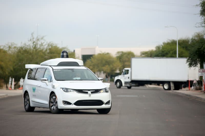 FILE PHOTO: A Waymo Chrysler Pacifica Hybrid self-driving vehicle returns to a depot in Chandler, Arizona