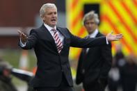 Stoke City manager Mark Hughes gestures during their English Premier League soccer match against Manchester City at the Britannia Stadium in Stoke-on-Trent September 14, 2013.