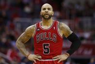 Chicago Bulls forward Carlos Boozer (5) stands on the court during a break in the action during the first half of Game 4 of an opening-round NBA basketball playoff series against the Washington Wizards in Washington, Sunday, April 27, 2014. (AP Photo/Alex Brandon)