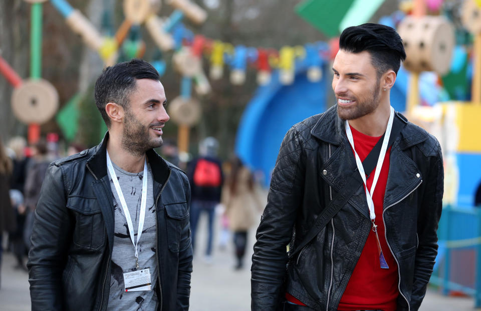Rylan Clark (centre) and his boyfriend Dan Neal (left) walk together as they accompany children from the Carers Trust and a community hub in a deprived area of east London on a charity day trip to Disneyland Paris.   (Photo by Chris Radburn/PA Images via Getty Images)