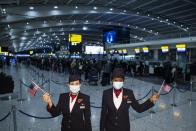 British Airways ambassadors Elysa Marsden, left, and Eugenia Okwaning at London Heathrow Airport’s T5 ahead of the departure of British Airways flight BA001, which will perform a synchronised departure on parallel runways alongside Virgin Atlantic flight VS3, heading for New York JFK to celebrate the reopening of the transatlantic travel corridor