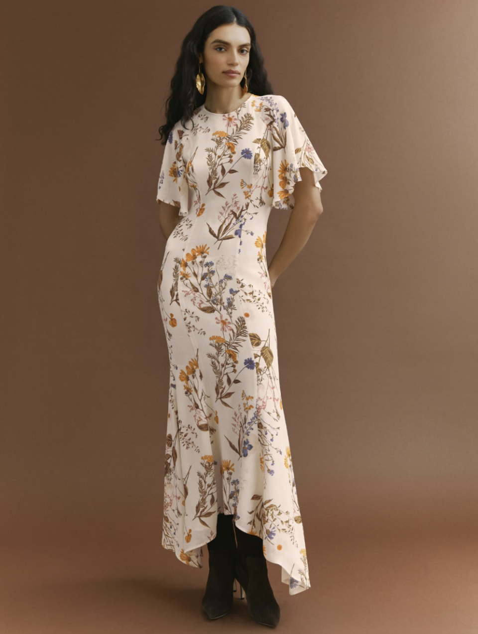 model with black hair and white and floral Carletta Dress (photo via Reformation)