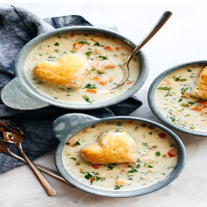 Three bowls of chicken pot pie soup.