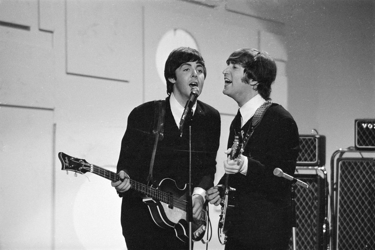 Paul McCartney, left, and John Lennon on the Ed Sullivan Show (CBS Photo Archive / Getty Images)