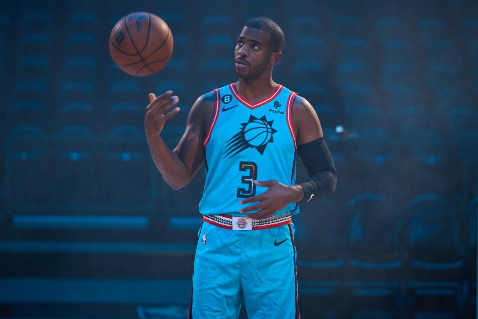 Phoenix Suns point guard Chris Paul previews the team's new City Edition uniform at Footprint Center in Phoenix, Ariz., on Oct. 14, 2022.