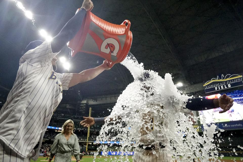 Milwaukee Brewers' Willy Adames douces Andruw Monasterio after a baseball game against the San Diego Padres Saturday, Aug. 26, 2023, in Milwaukee. The Brewers won 5-4. (AP Photo/Morry Gash)