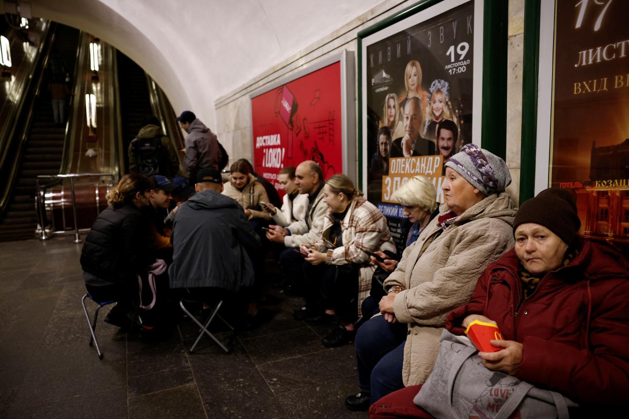 People sit in a metro station to shelter from an air raid, during Russia's attack on Ukraine, in Kyiv (REUTERS)
